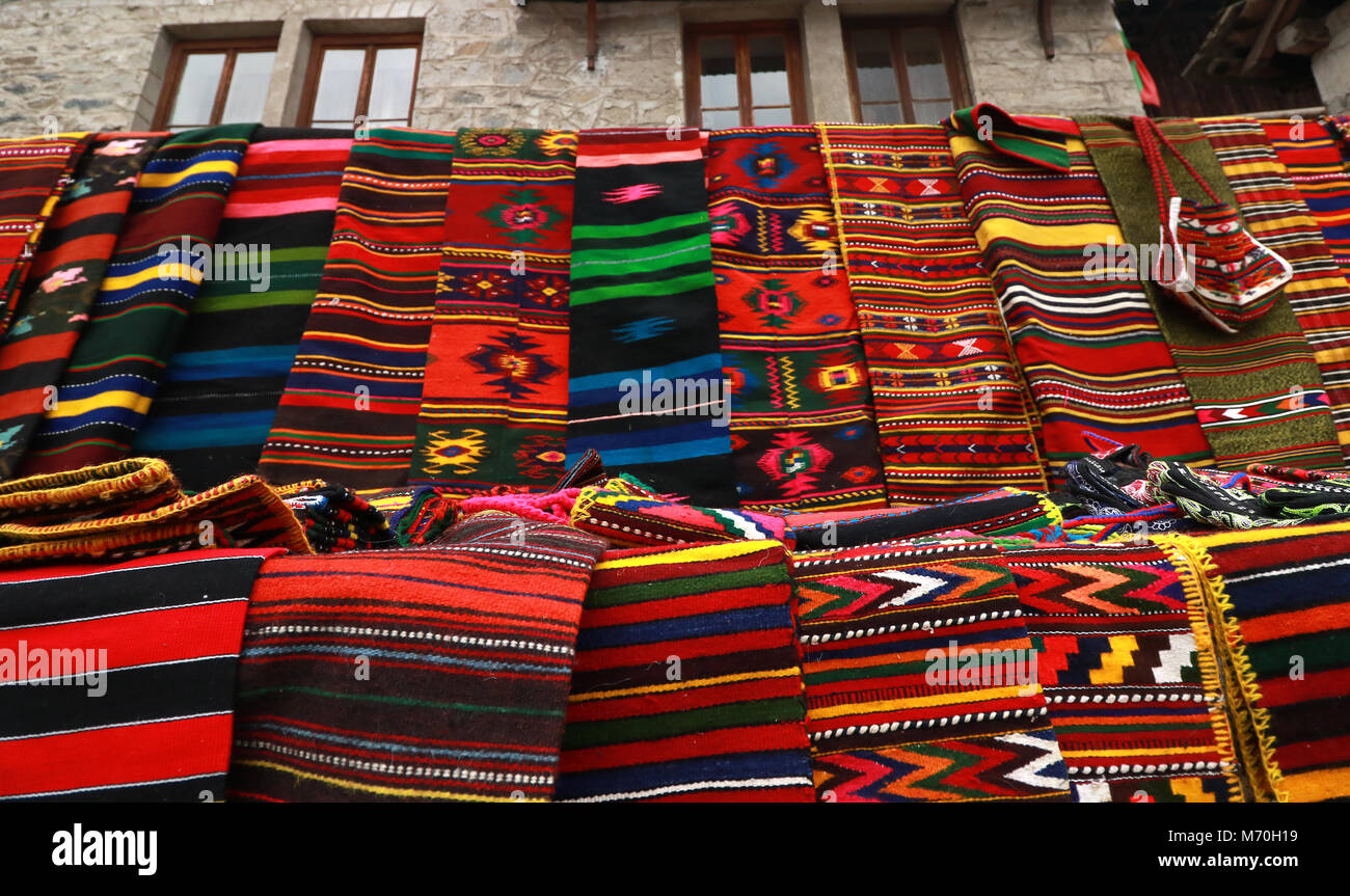 Folk Pattern Rug Hand-woven carpet with ethnic and folk pattern. Colorful rug and clay ...