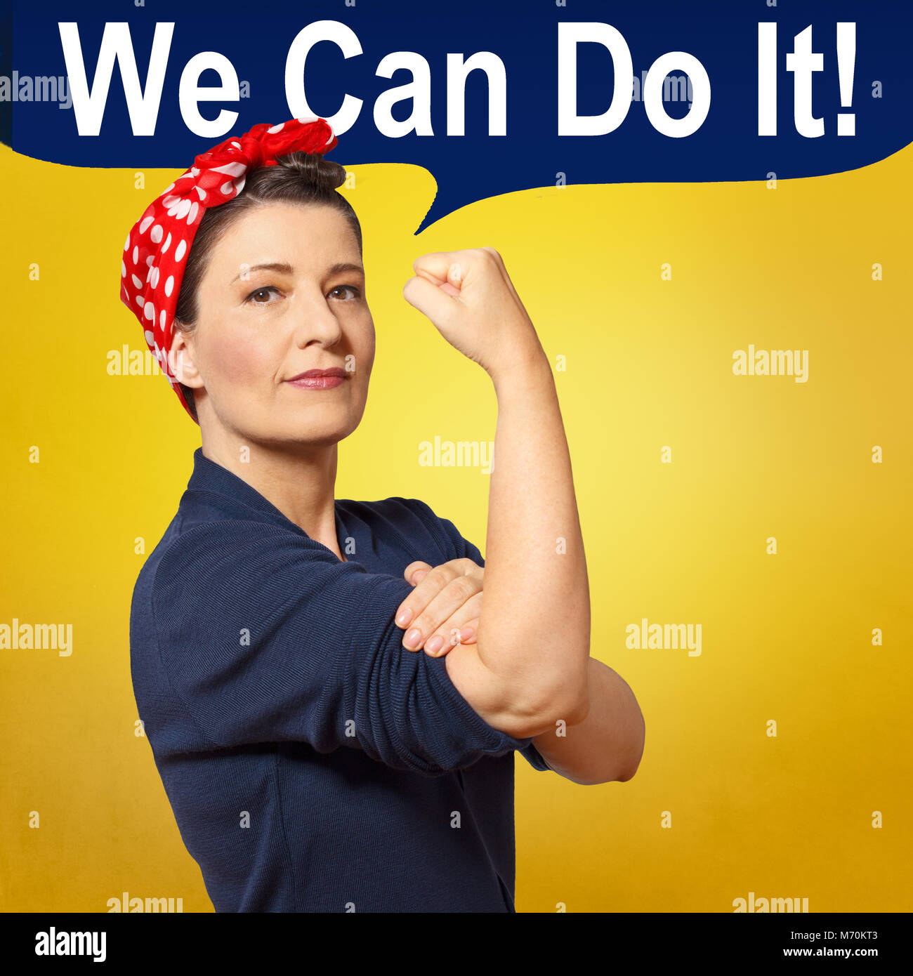 Tough and self-confident woman with a clenched fist, speech bubble with text WE CAN DO IT, tribute to american icon Rosie Riveter, square format Stock Photo