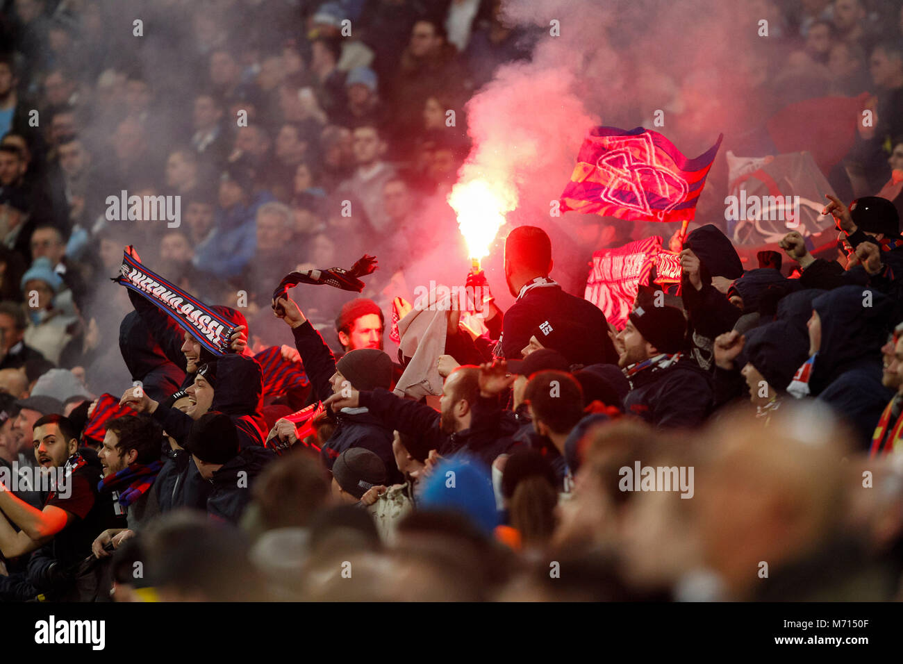 Manchester, UK. 7th March. 2018. Basel fans light flares during the UEFA Champions League Round
