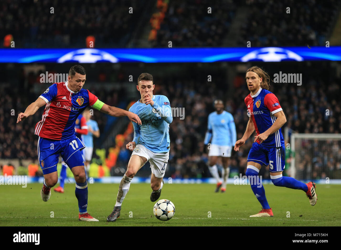 Manchester, UK. 7th March 2018 , Champions League Round of 16 leg 2, Manchester City versus FC Basel; Phil Foden #47 of Manchester City beats Marek Suchy #17 of Basel Stock Photo