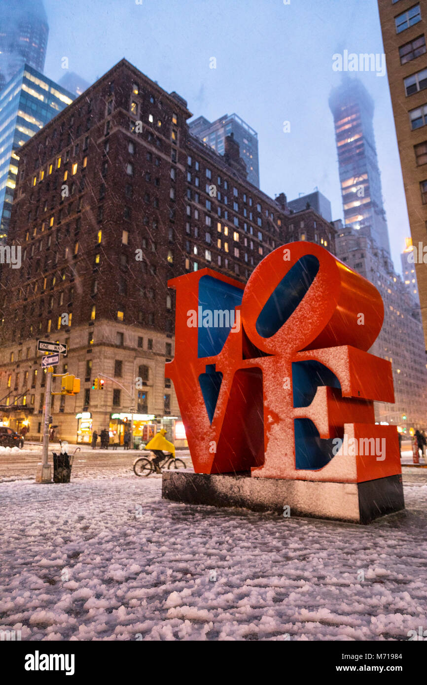 New York City, USA. 7th March, 2018. Snowfall in New York City; Love pop art sculpture at 55th street Credit: Nino Marcutti/Alamy Live News Stock Photo