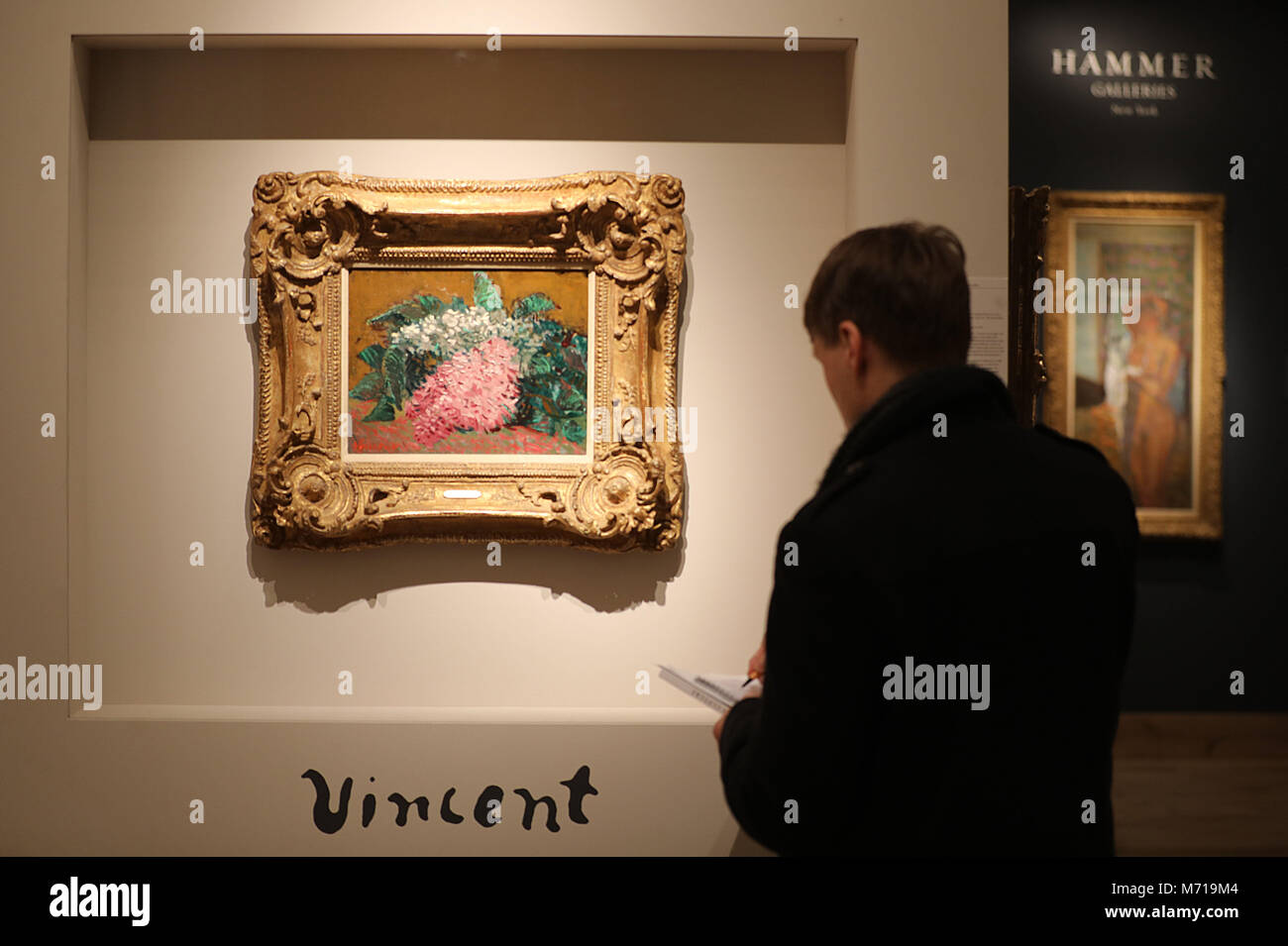 07 March 2018, Netherlands, Maastricht: A visitor stands in front of the painting 'Lilacs' by Vincent van Gogh at the stand of the gallery Hammer at the International Arts and Antiquities Fair TEFAF. The fair takes place from 09 to 18 March 2018. Photo: Oliver Berg/dpa - ACHTUNG: Nur zur redaktionellen Verwendung im Zusammenhang mit einer Berichterstattung über die Kunstmesse TEFAF Stock Photo