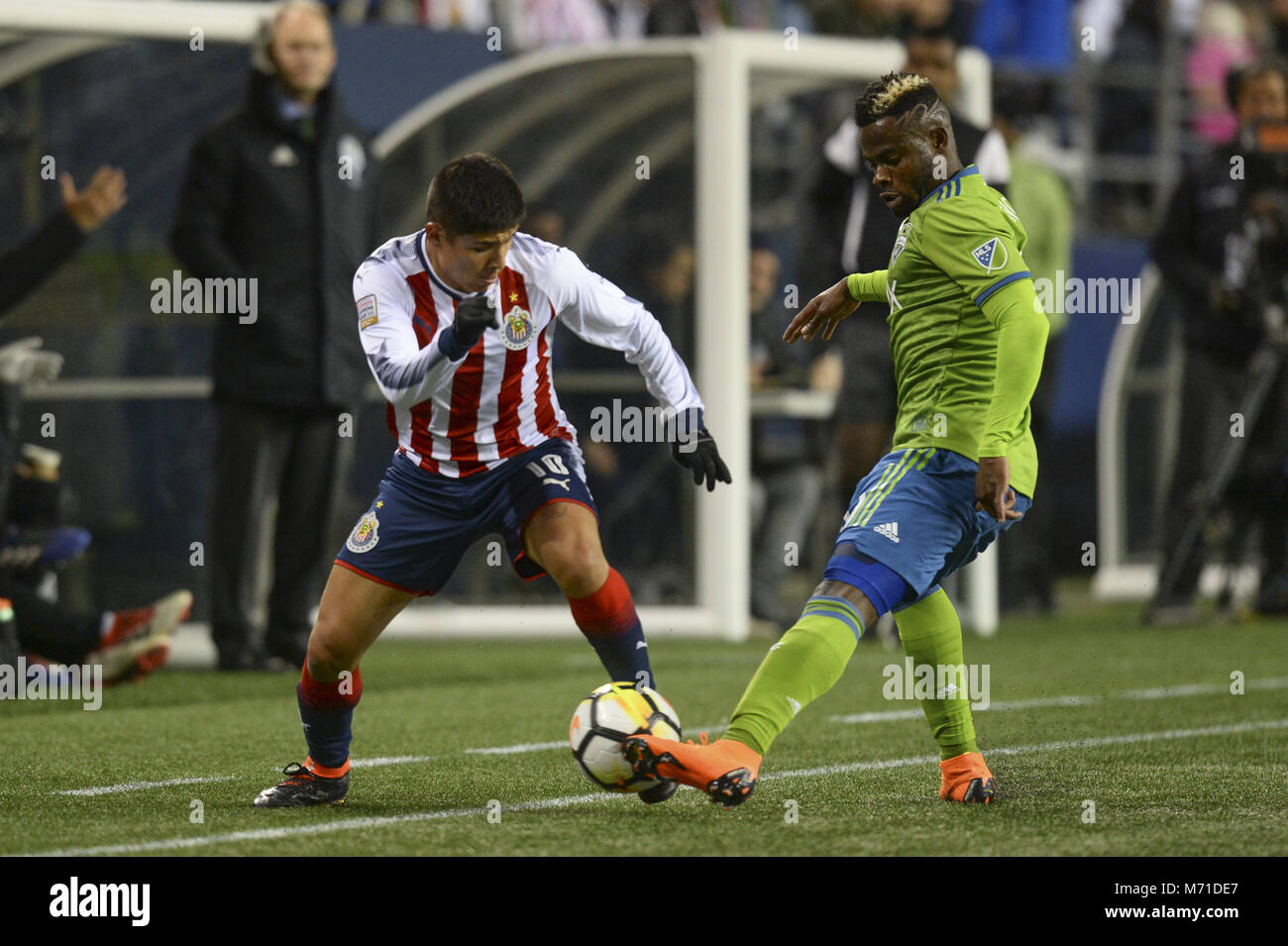 Seattle, Washington, USA. 7th Mar, 2018. CONCACAF Soccer 2018: WAYLON FRANCIS (90) defends against EDUARDO LOPEZ (10) as Chivas Guadalajara visits the Seattle Sounders in a CONCACAF quarterfinal match at Century Link Field in Seattle, WA. Seattle won the match 1-0. Credit: Jeff Halstead/ZUMA Wire/Alamy Live News Stock Photo