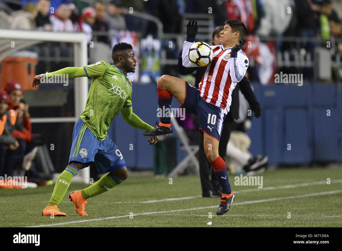 Seattle, Washington, USA. 7th Mar, 2018. CONCACAF Soccer 2018: WAYLON FRANCIS (90) defends against EDUARDO LOPEZ (10) as Chivas Guadalajara visits the Seattle Sounders in a CONCACAF quarterfinal match at Century Link Field in Seattle, WA. Seattle won the match 1-0. Credit: Jeff Halstead/ZUMA Wire/Alamy Live News Stock Photo