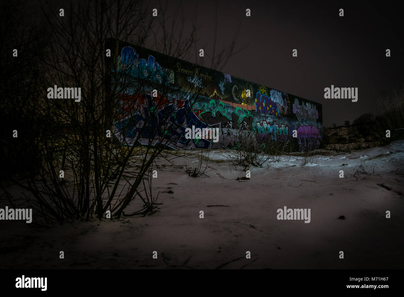 Graffiti in the snow on a derelict wall in Hertfordshire Stock Photo
