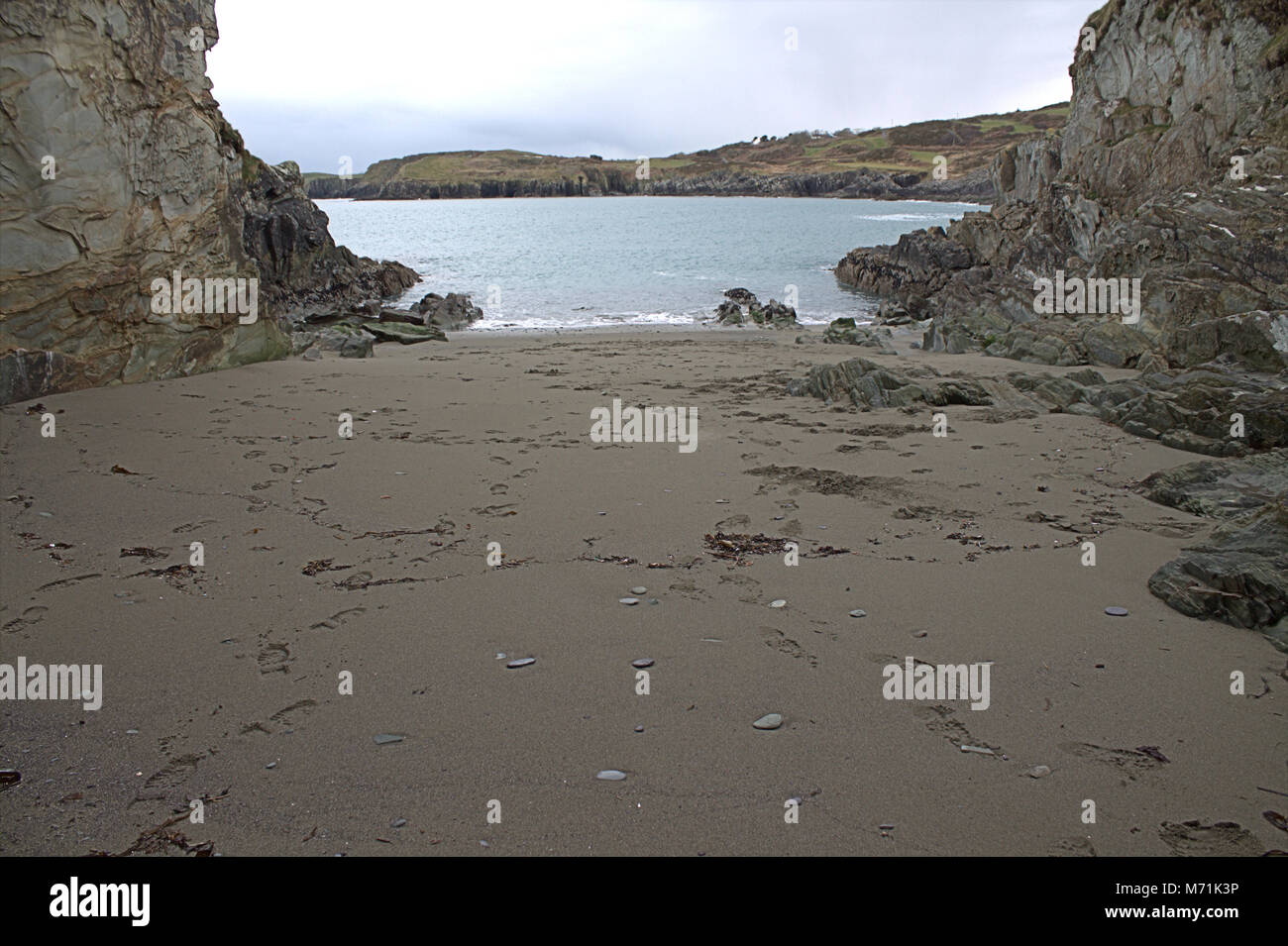 Footprints in the sand of a quiet sandy cove, on the coast of West Cork, Ireland. Stock Photo