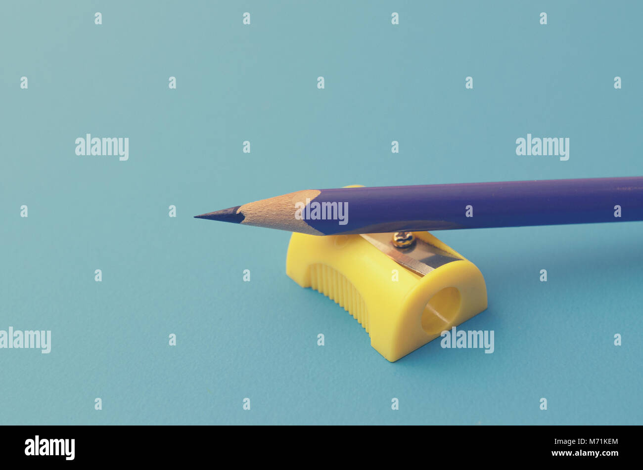 Sharpen the colored pencils with a sharpener Stock Photo Alamy