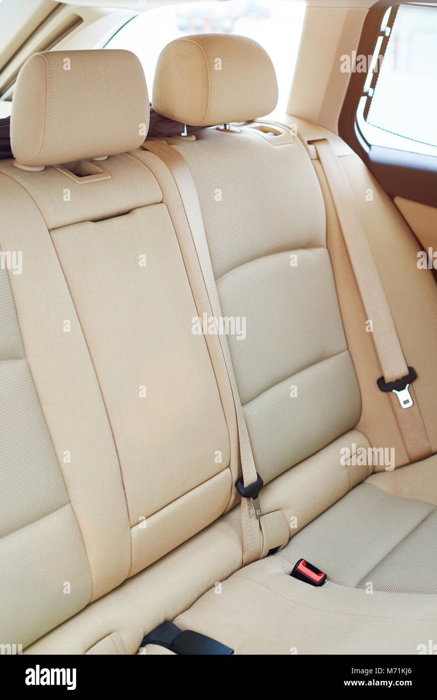 Clean brown back seat of modern car. Closeup of backseat car with