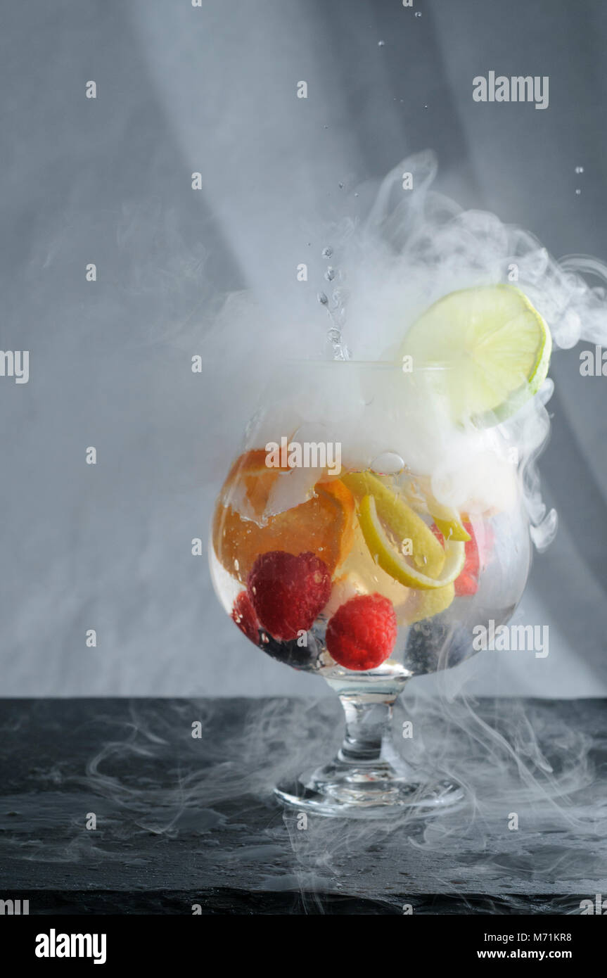 Smoking craft cocktail with fruit Stock Photo Alamy
