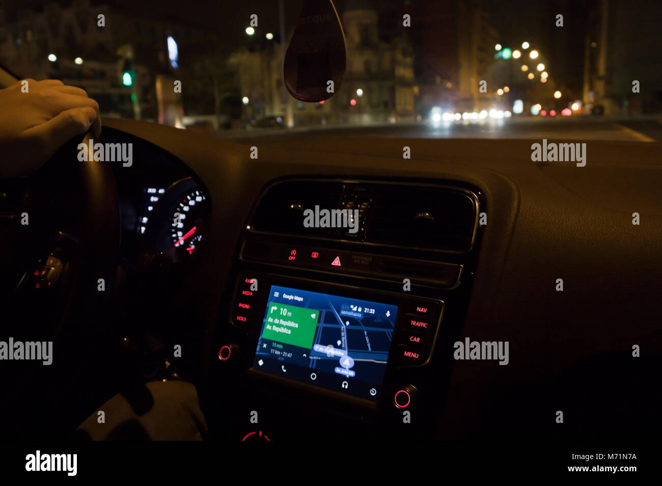 Driving car with google maps gps on dashboard (Lisbon, Portugal) Stock Photo