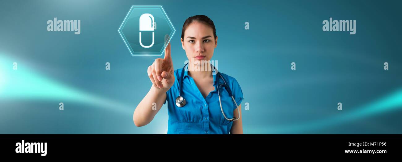 Female doctor interacting with medication pill icon in hexagon interface Stock Photo