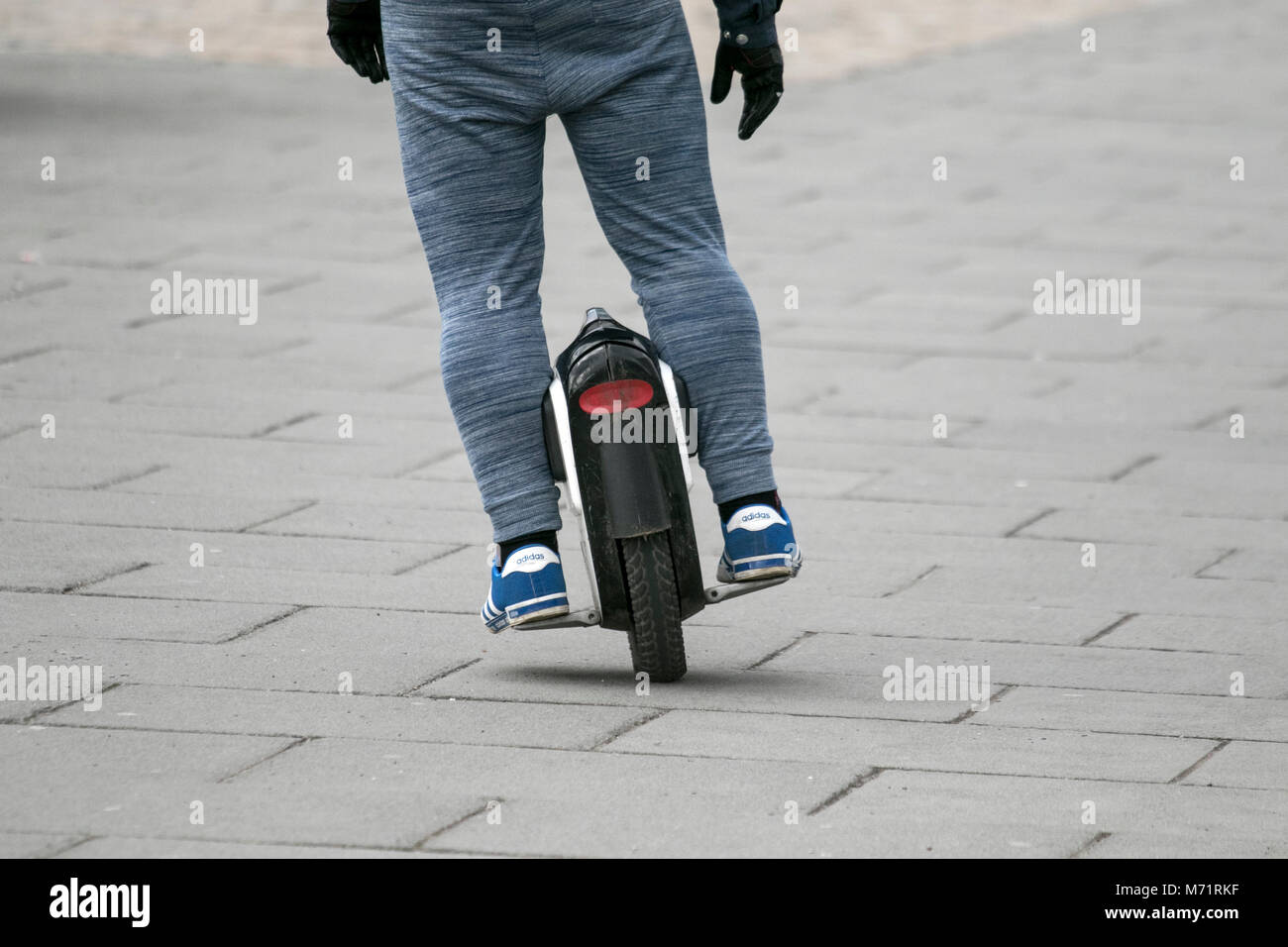 Electric one wheel mono scooter, unicycle self balance a balancing mode of transport, Liverpool city UK Stock Photo