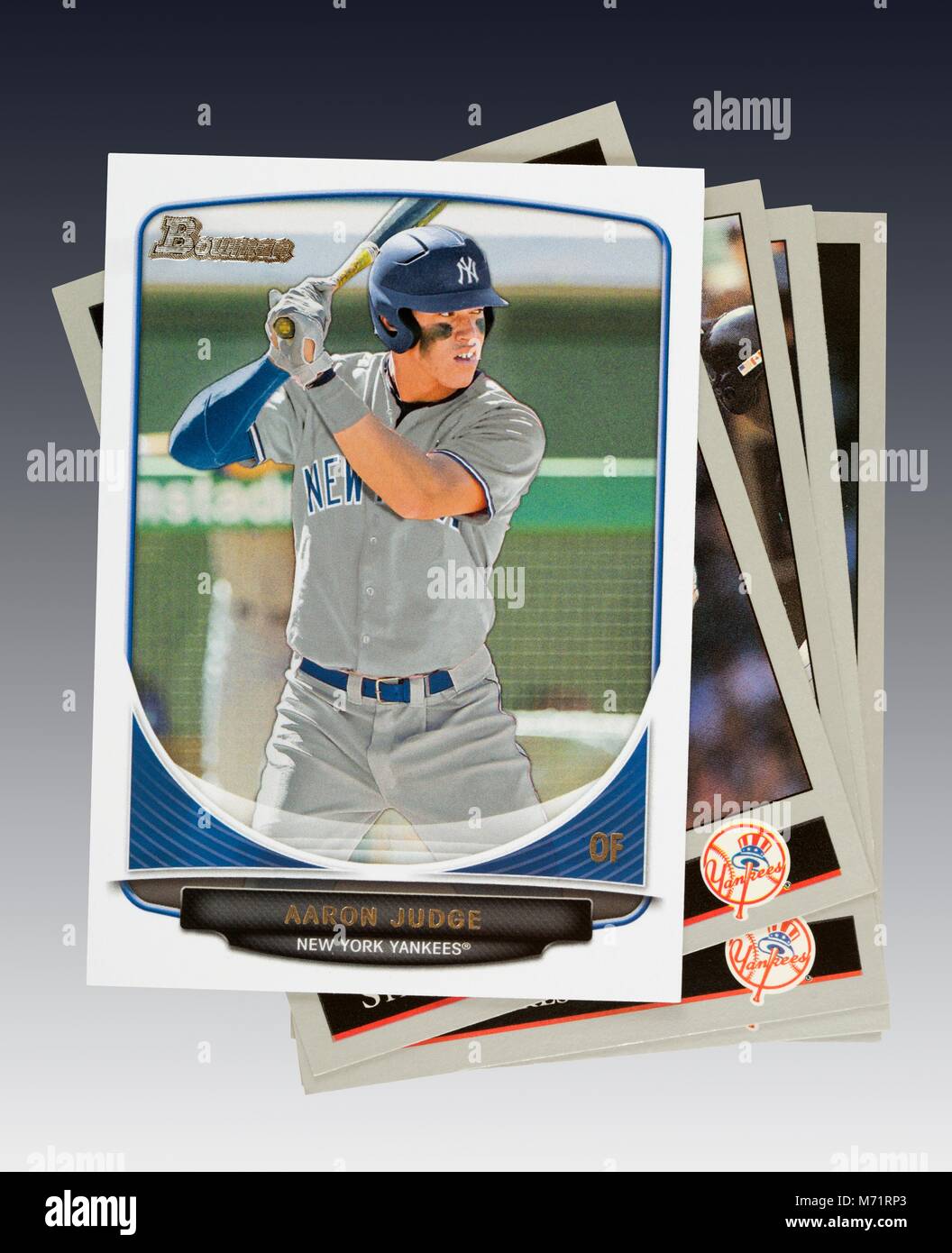 Aaron Judge of the New York Yankees 2013 Bowman rookie card on top of stack of baseball cards Stock Photo