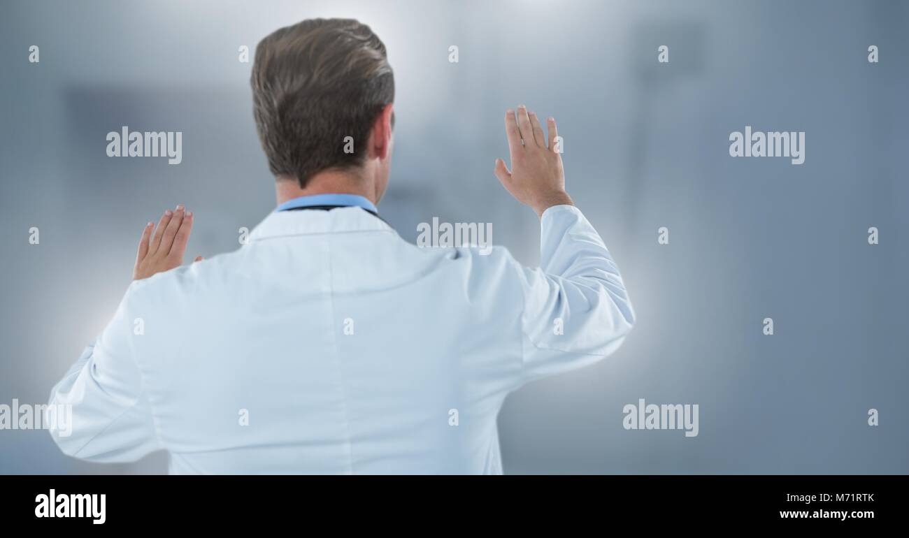 Male doctor interacting with air touch Stock Photo