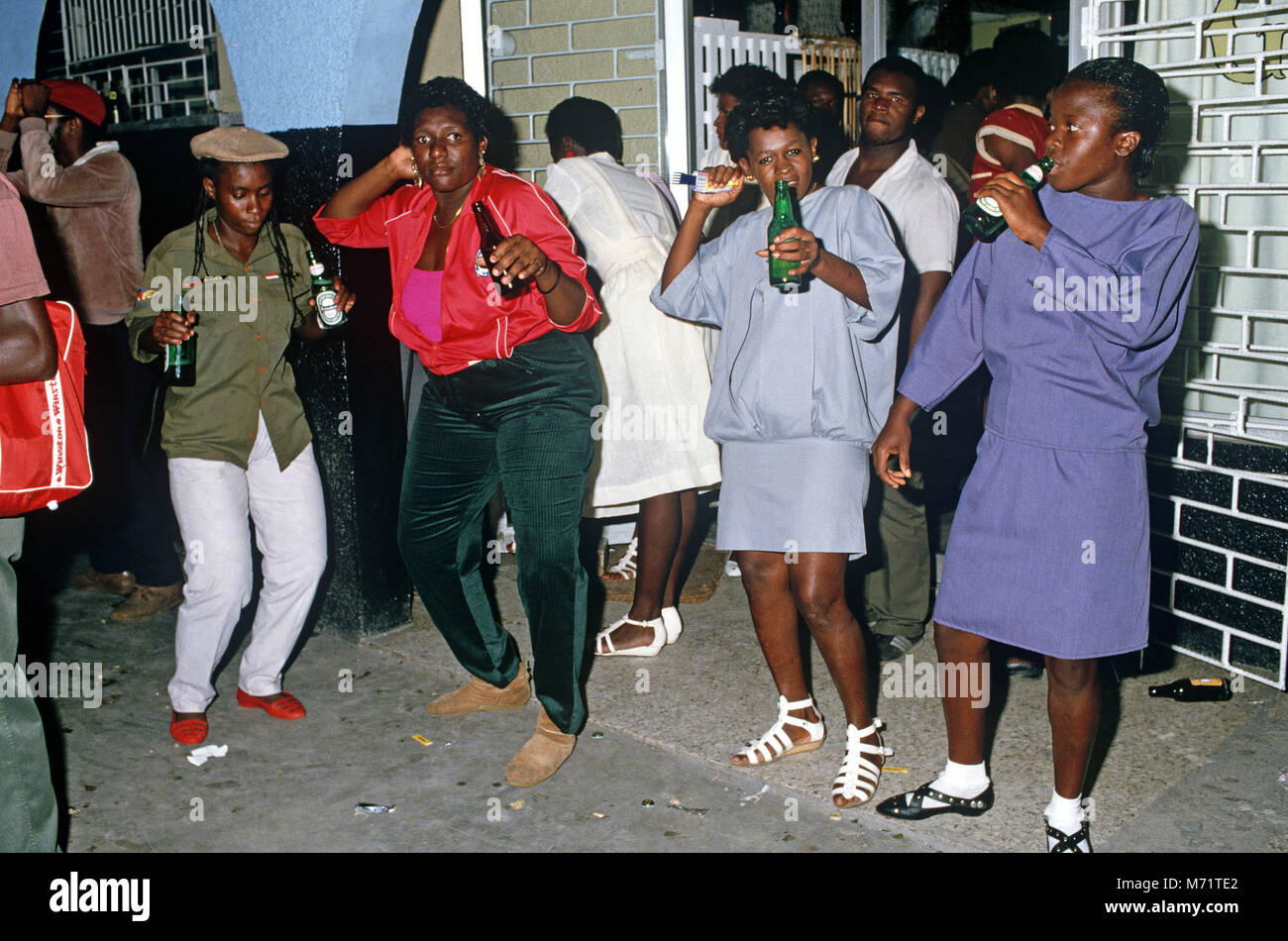 Women drinking at Half Way Tree Bar, Kingston, Jamaica Stock Photo Alamy