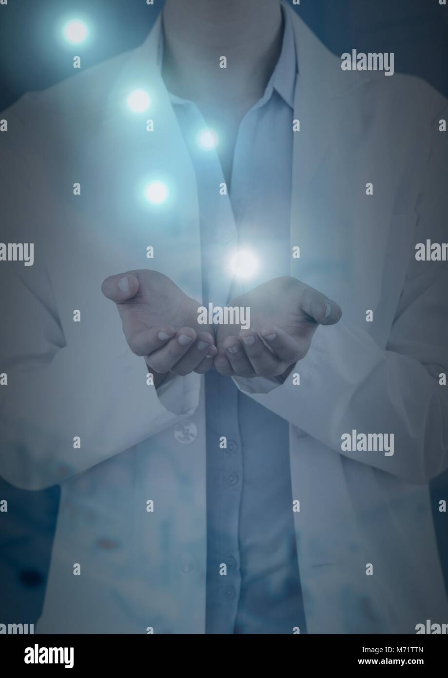 Doctor opening hands with glowing lights Stock Photo