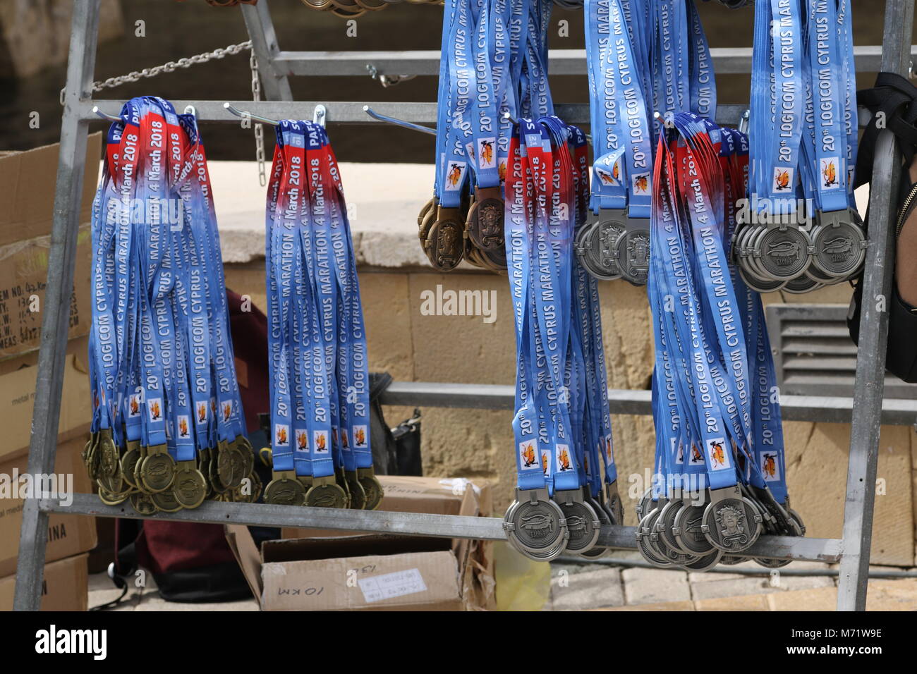 Medals awaiting awarding at the 20th Logicom Cyprus marathon, half marathon, 10KM, 5KM fun run for international competitors in Paphos, Cyprus, Europe Stock Photo