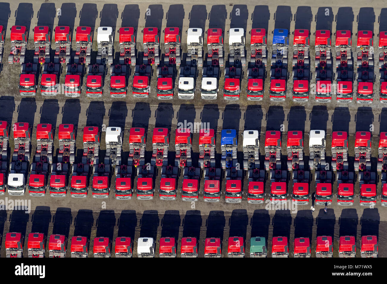 Aerial view, red tractors in rank and file, Mercedes-Benz, Mercedes trucks, tractors, new truck parking space on the site Recklinghausen-Hochlarmark t Stock Photo