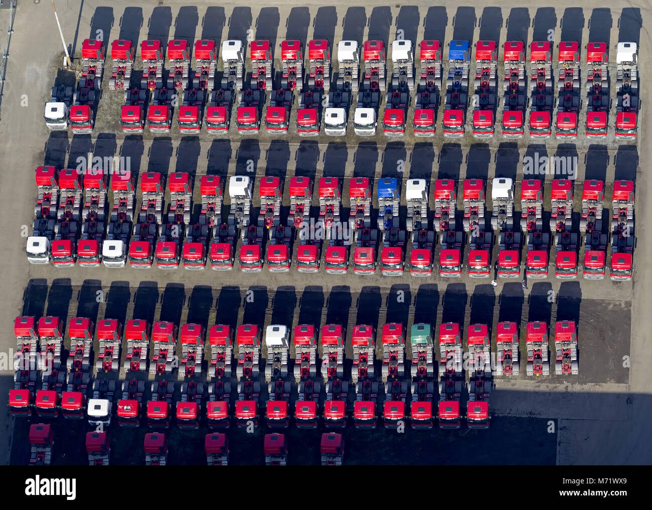 Aerial view, red tractors in rank and file, Mercedes-Benz, Mercedes trucks, tractors, new truck parking space on the site Recklinghausen-Hochlarmark t Stock Photo