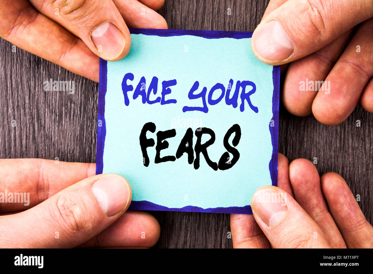 Handwriting Announcement text showing Face Your Fears. Conceptual photo Challenge Fear Fourage Confidence Brave Bravery written Sticky Note Paper Hold Stock Photo