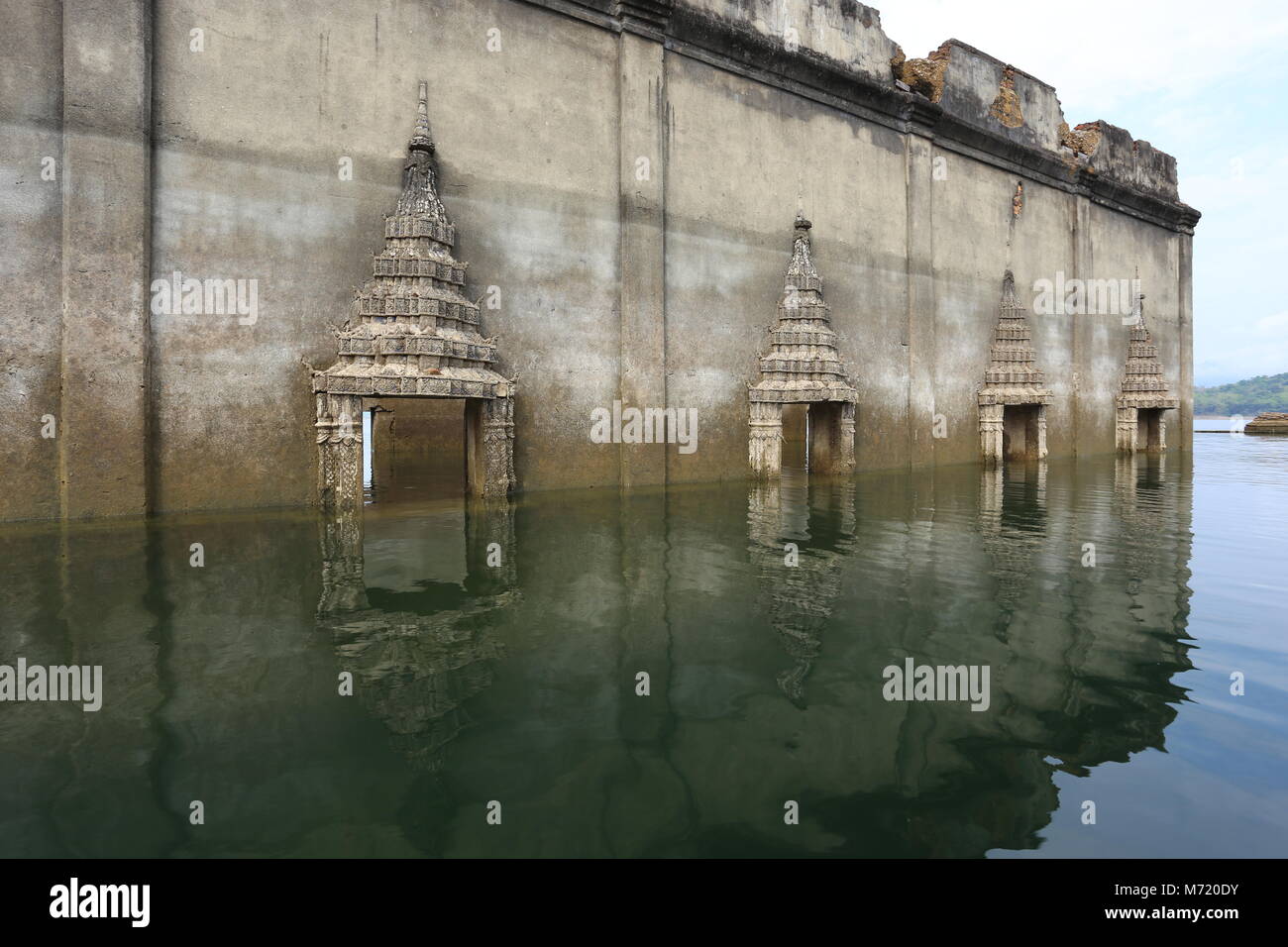 The Sunken Temple, Wat Saam Prasob, is the only remaining structure in this village purposely flooded after construction of the Khao Lem Dam. Stock Photo