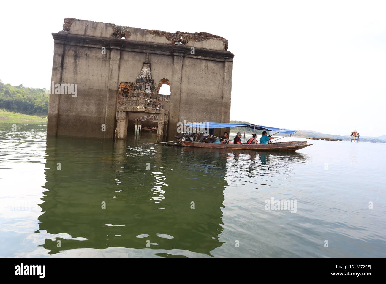 The Sunken Temple, Wat Saam Prasob, is the only remaining structure in this village purposely flooded after construction of the Khao Lem Dam. Stock Photo