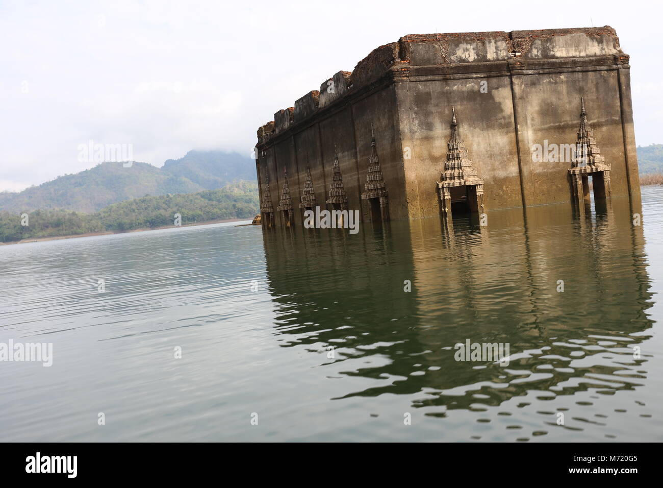 The Sunken Temple, Wat Saam Prasob, is the only remaining structure in this village purposely flooded after construction of the Khao Lem Dam. Stock Photo