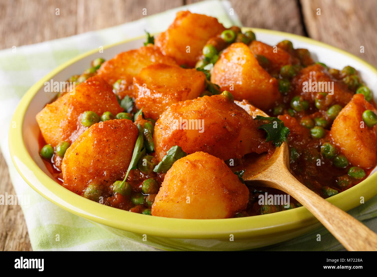 Indian hot Aloo Matar potatoes, green peas, herbs and spicy sauce