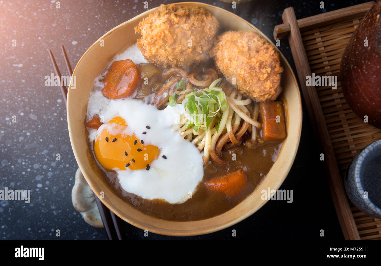 Japanese curry with udon noodle and crispy pork chop croquettes and