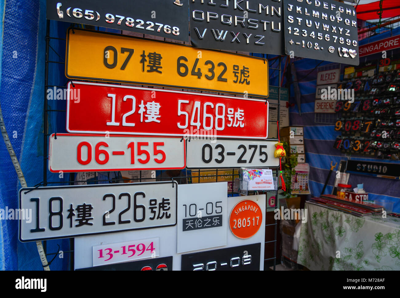 Singapore - Feb 9, 2018. Number registration plate for sale at street market in Chinatown, Singapore. Stock Photo