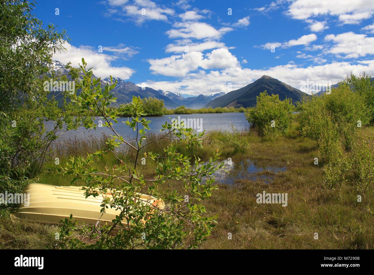 Landscape with Rowing Boat, Lake Wakatipu, Glenorchy, New Zealand Stock Photo