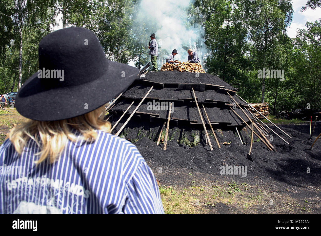 CHARCOAL BURNERS start a Charcoal stack Stock Photo Alamy