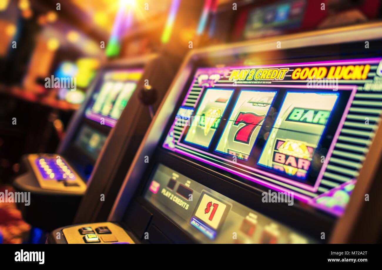 Casino Interior and Row of Classic Slot Machines. Las Vegas Gambling Theme. Stock Photo