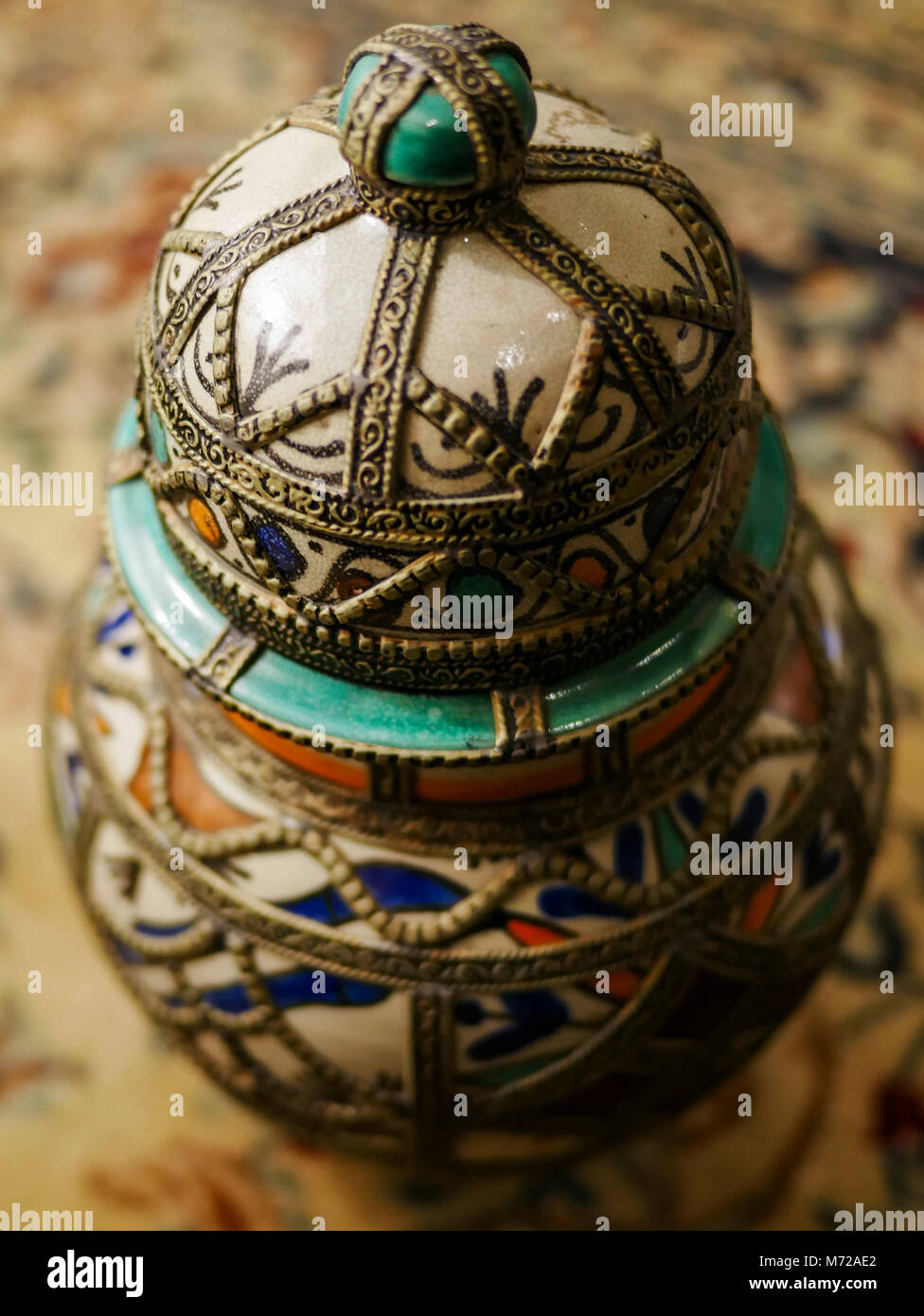 A close up of a beautiful and intricate urn with a elegant background Stock Photo
