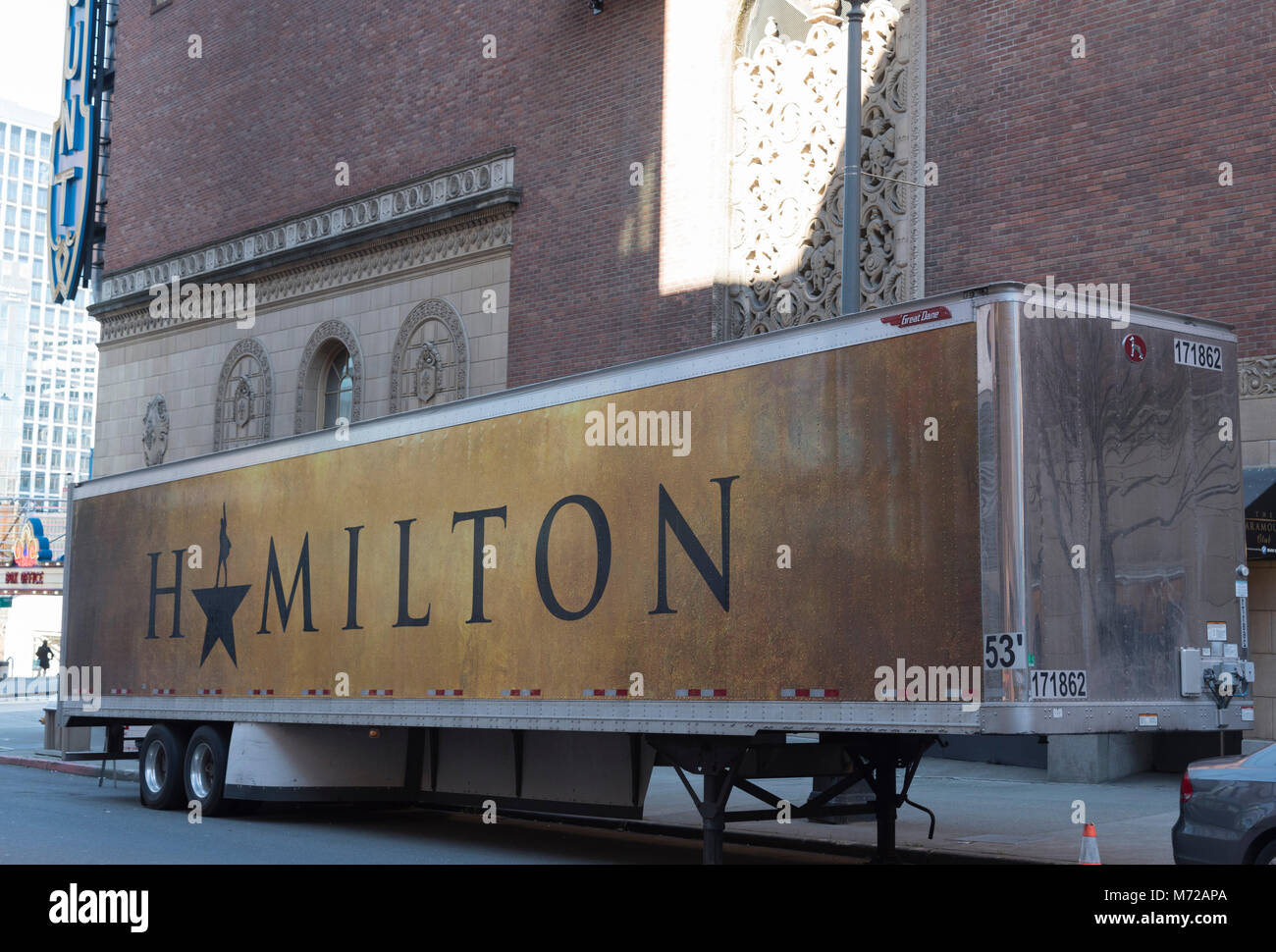 The Historic Paramount theater showing the award winning Broadway musical Hamilton in downtown Seattle afternoon under blue sky: Angled trailer view Stock Photo