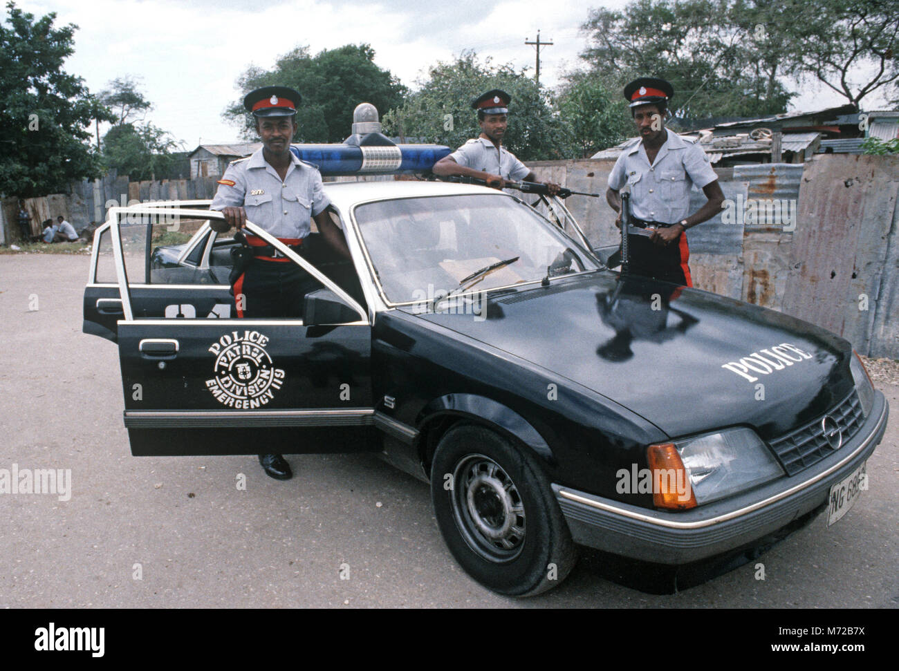 Armed Kingston police with patrol car, Jamaica Stock Photo Alamy