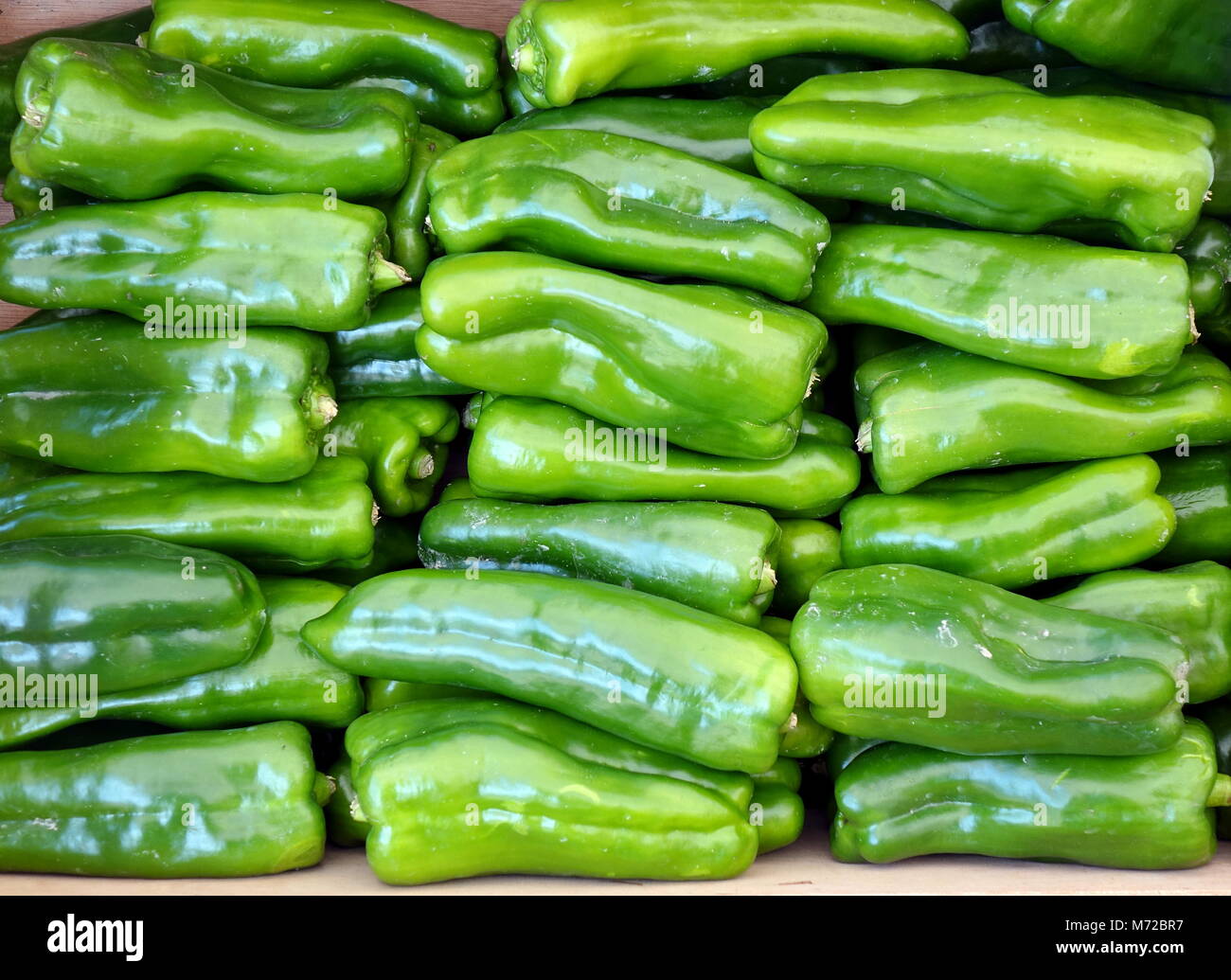 Bright green bell peppers for sale at the market Stock Photo - Alamy