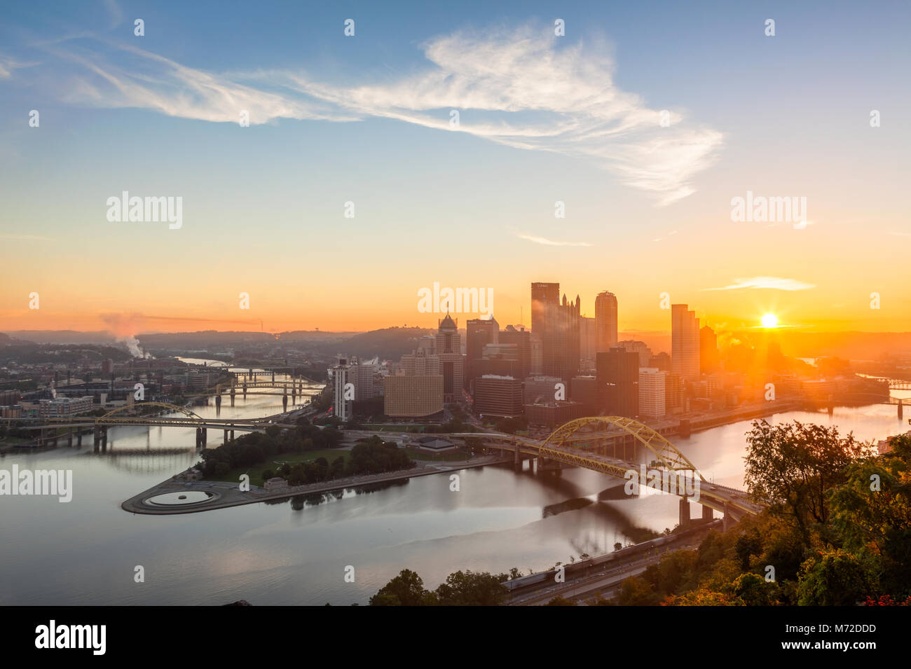The downtown Pittsburgh skyline with the Allegheny River and the Monongahela River at sunrise in Pittsburgh, Pennsylvania, USA. Stock Photo