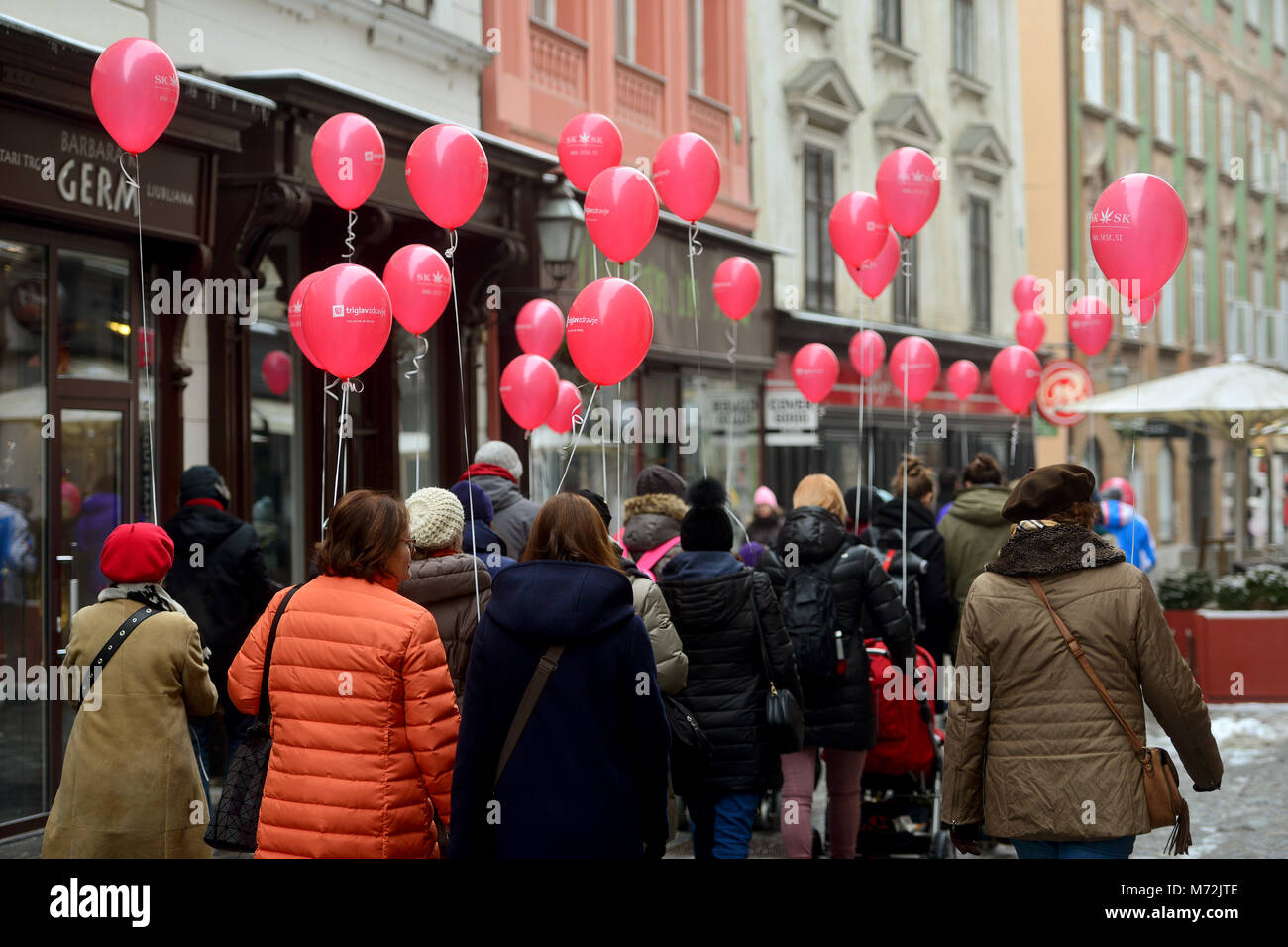 Ljubljana, Slovenia on MARCH 3., 2017. People at all-Slovenian hike with red balloons at the international Rare Disease Day Stock Photo