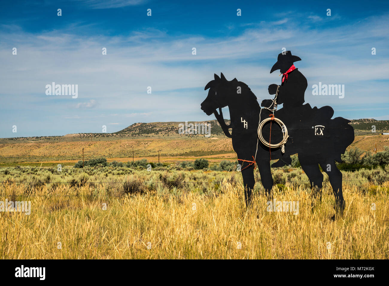 Cowboy silhouette metal cutout at ranch in Yampa River Valley, near
