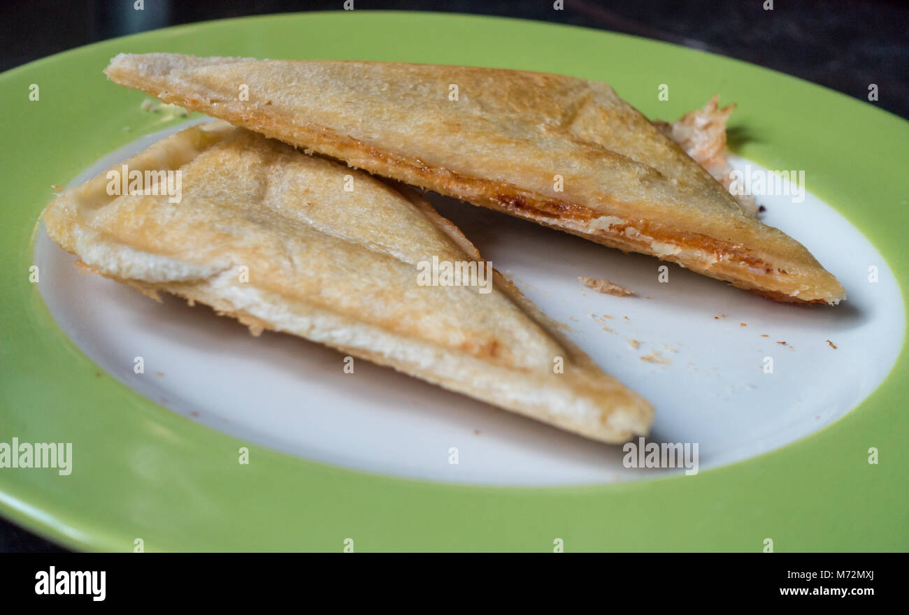 A close up view of toasted sandwiches on a plate ready to eat. Stock Photo