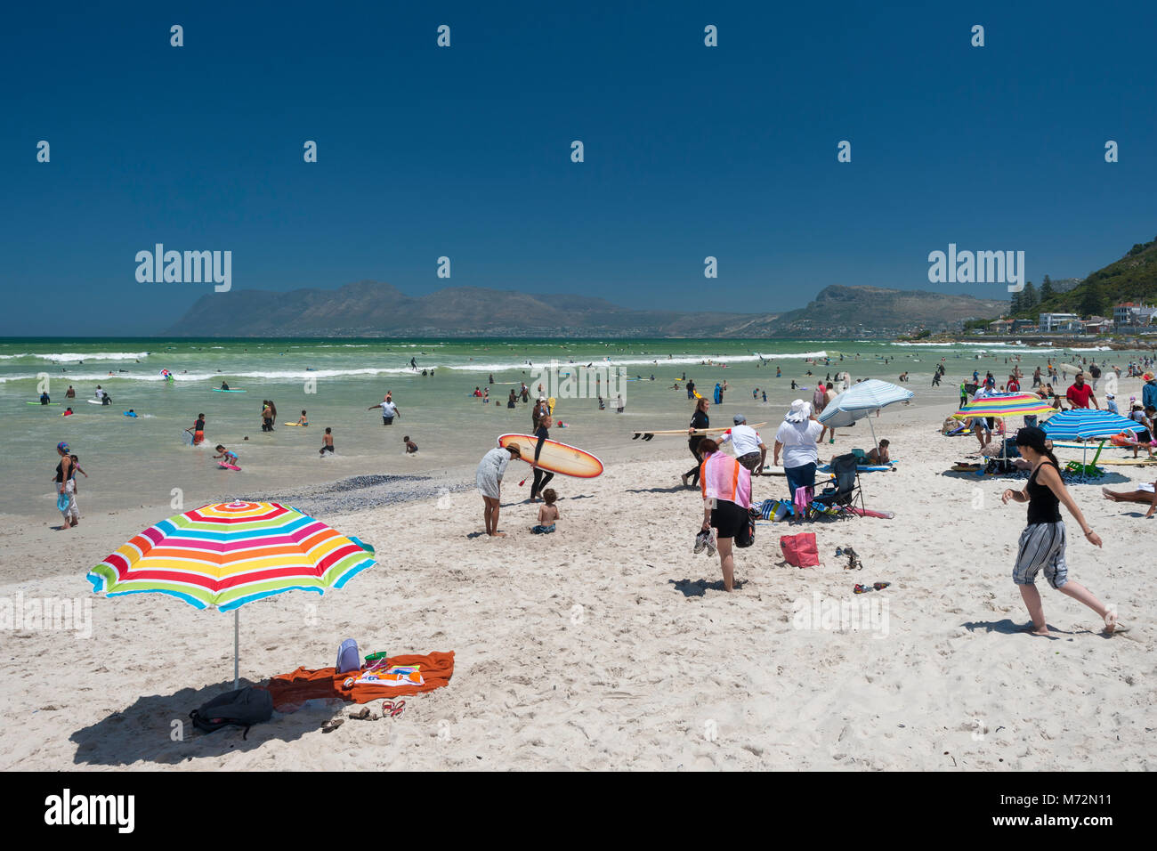 Crowds of people on Muizenberg beach in Cape Town, South Africa. Stock Photo
