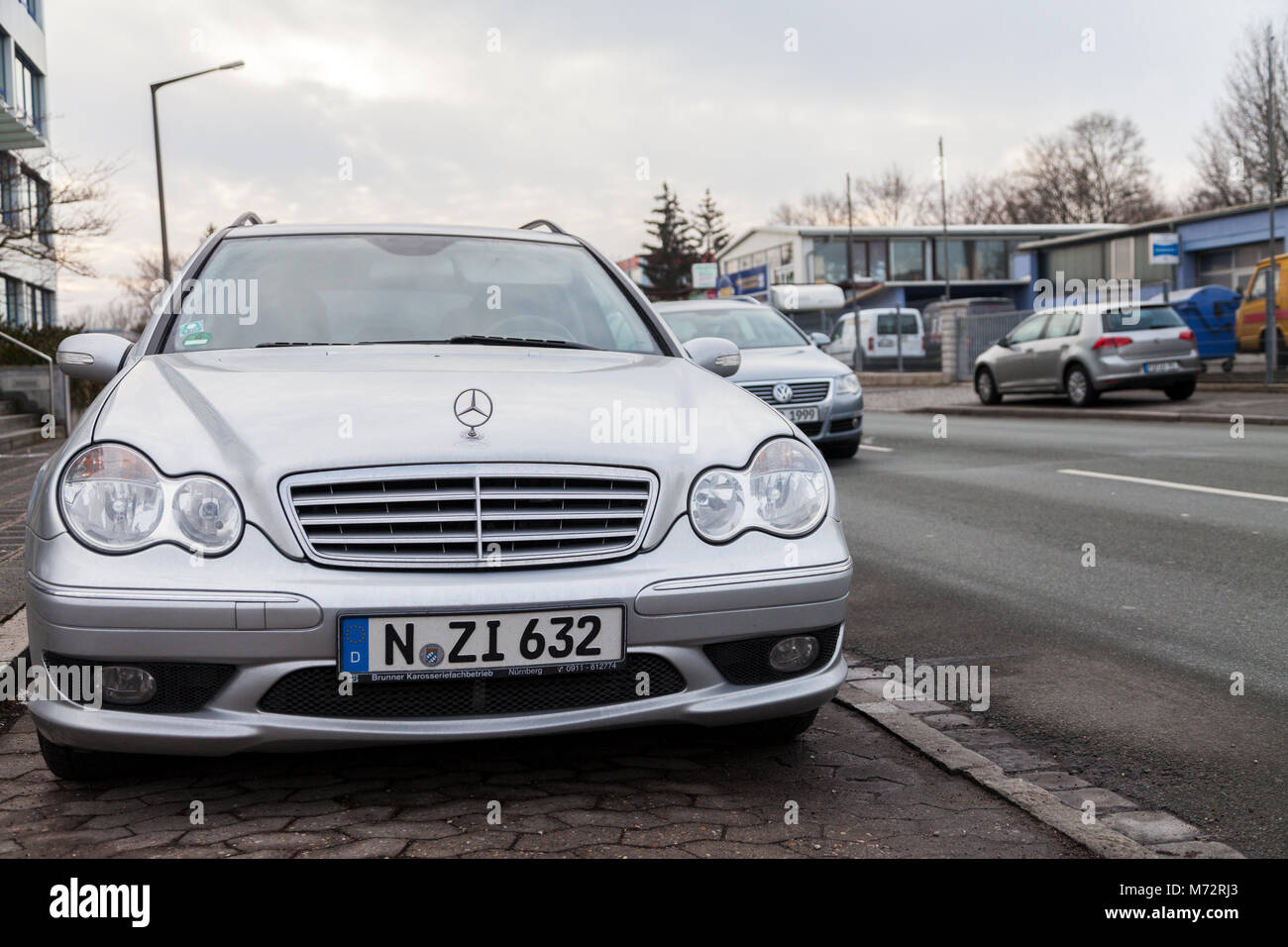 NUERNBERG / GERMANY - MARCH 4, 2018: Mercedes Benz car stands on a parking stripe near a street in a industrial destrict. Stock Photo
