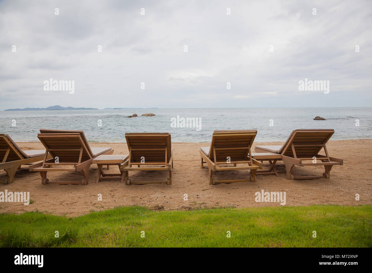 Empty deck chairs on the beach. Stock Photo