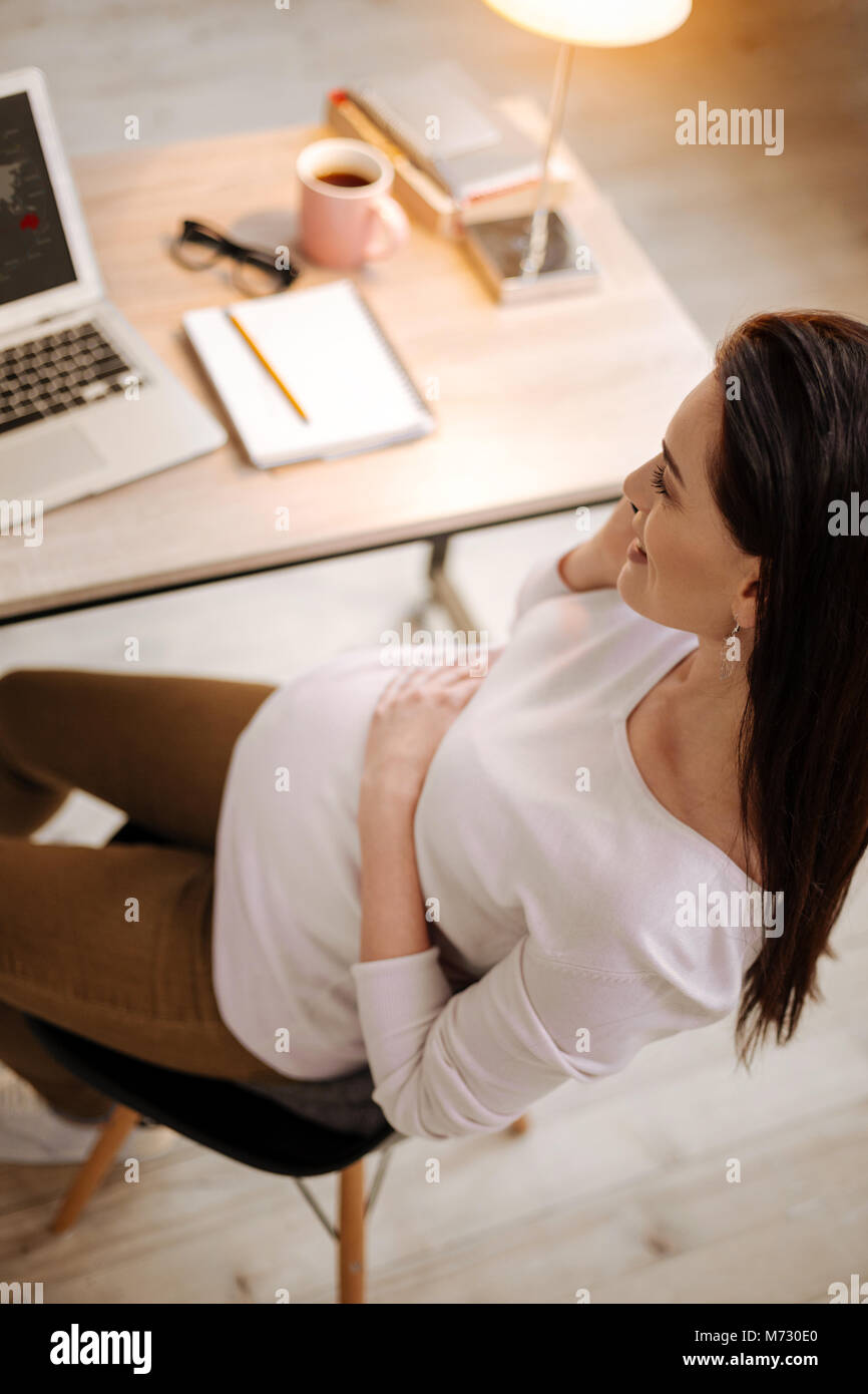 pregnant woman sitting on chair Stock Photo Alamy