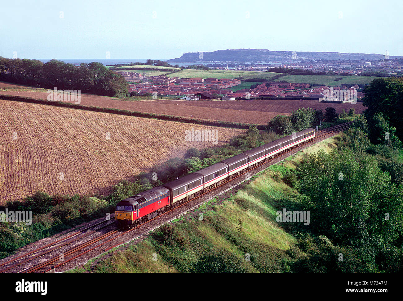 A class 47 diesel locomotive number 47489 climbs Upwey Bank with a train of empty coaching stock on the 11th September 1993. Stock Photo