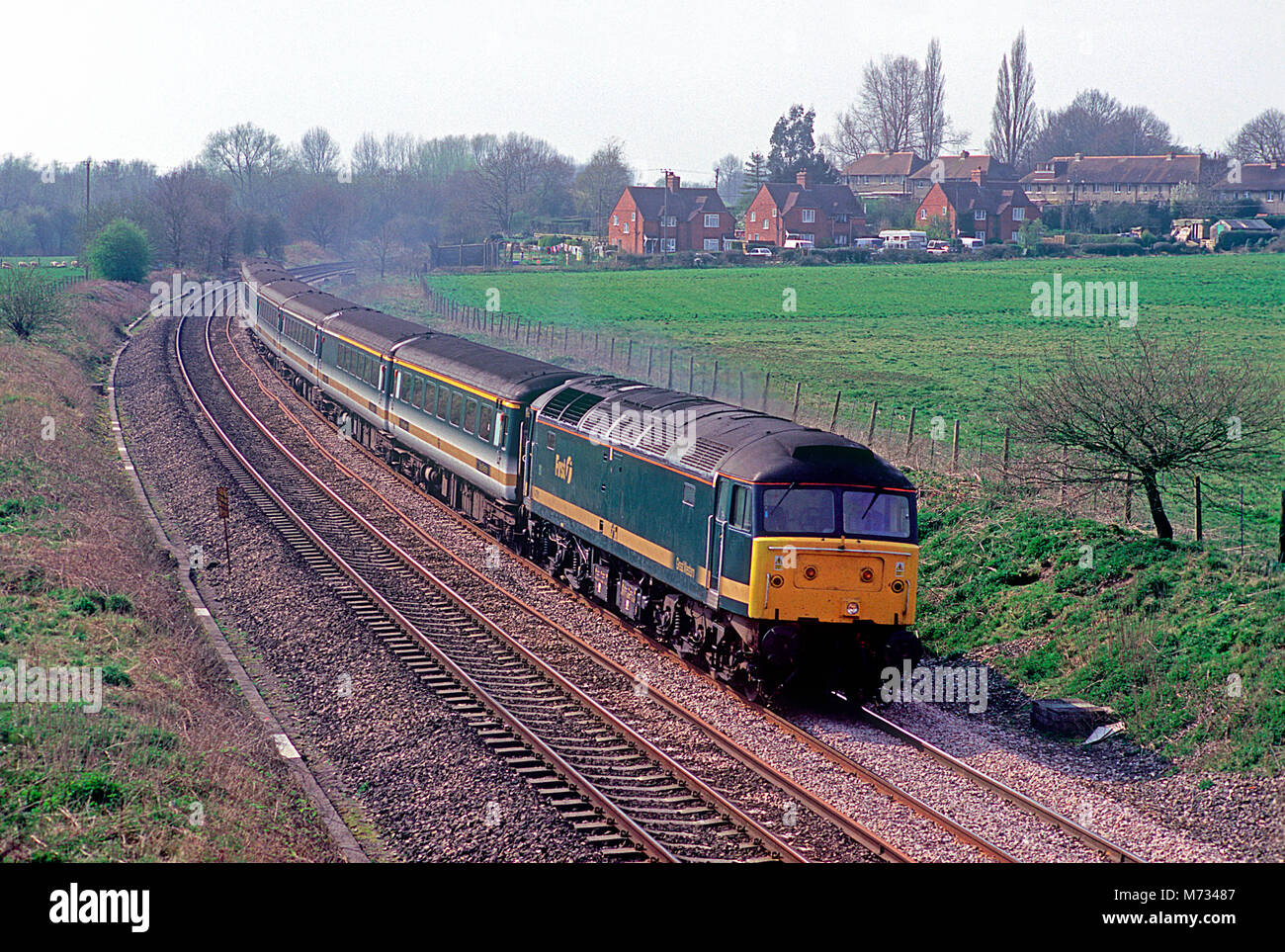 A class 47 diesel locomotive number 47811 working a First Great Western service at Aldermaston on the 30th March 2002. Stock Photo