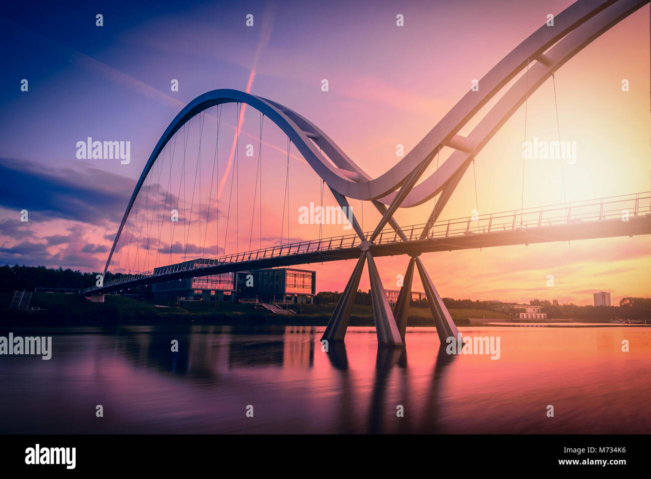 Infinity Bridge on dramatic sky at sunset in Stockton-on-Tees, UK. Stock Photo