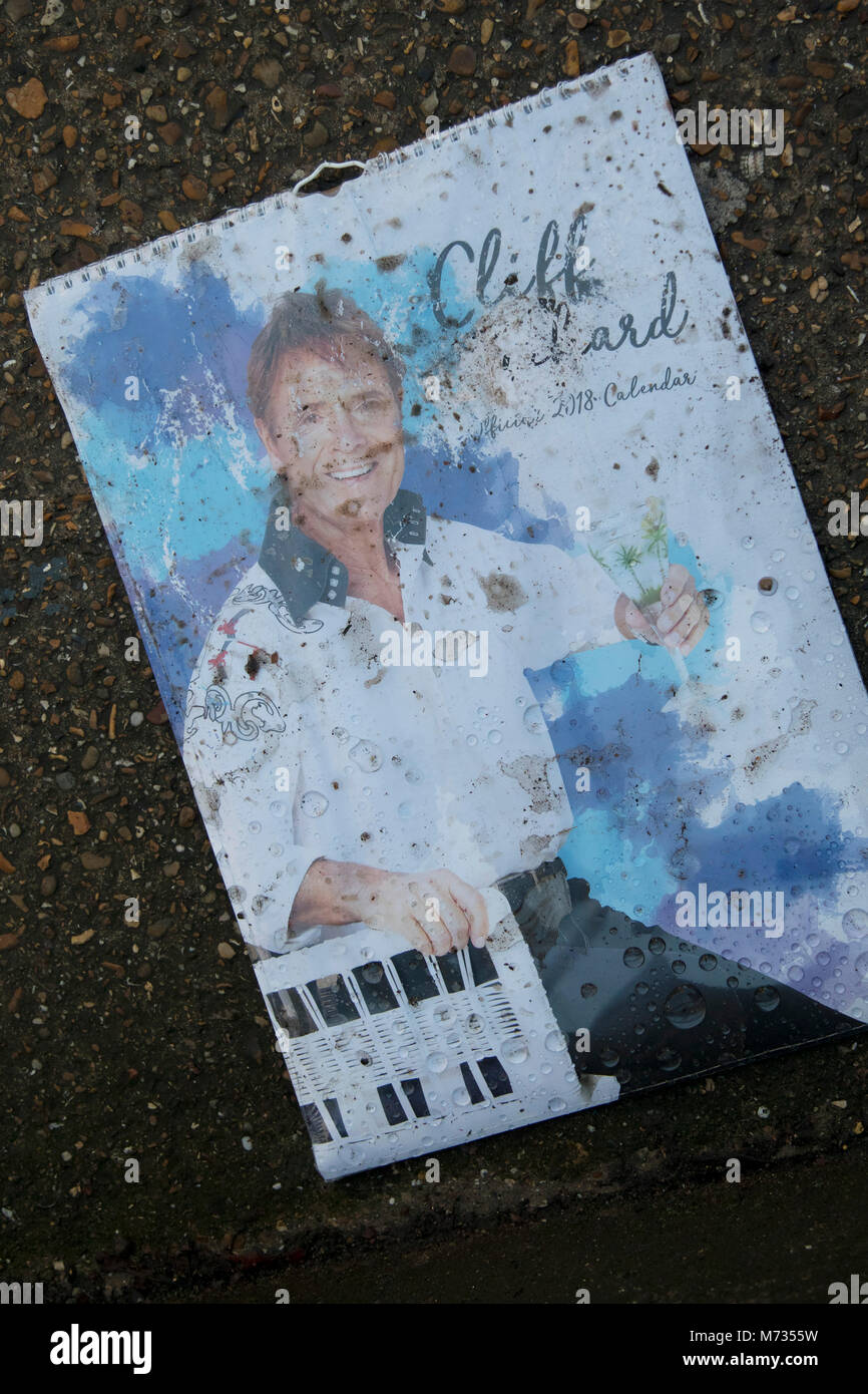 Discarded Sir Cliff Richard calendar in London, England, United Kingdom. Sir Cliff Richard OBE is a British pop singer, musician, performer, actor and philanthropist. Richard has sold more than 250 million records worldwide. Stock Photo