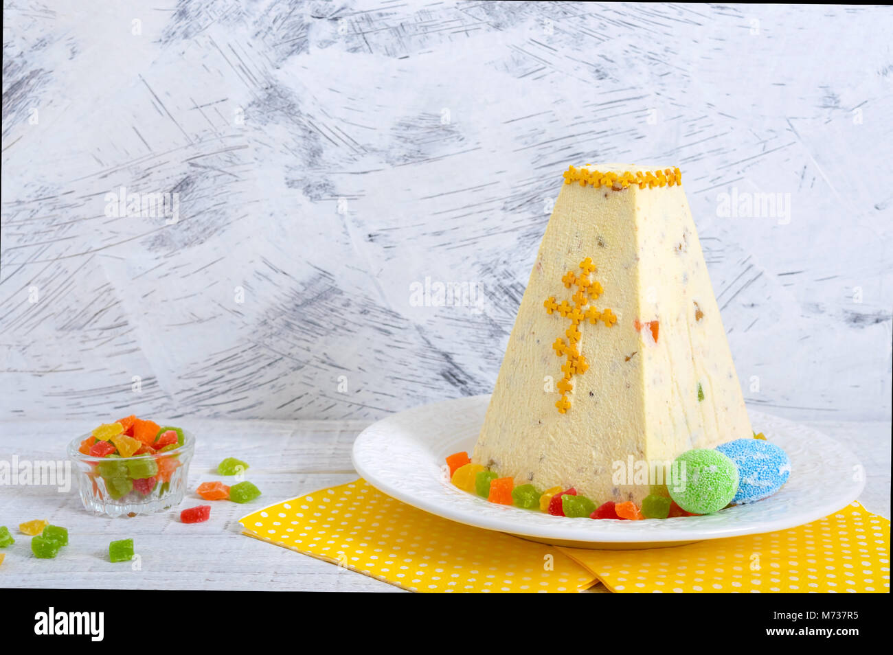 Traditional curd Easter cake with candied fruits on the holiday light
